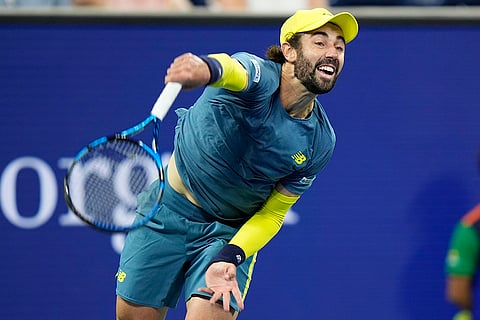 US Open Tennis: Jordan Thompson, of Australia, serves to Alex de Minaur